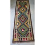 A hand knotted woollen Maimana Kilim runner, 197cm x 67cm