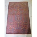 A hand knotted woollen Baluchi rug, 132cm x 86cm