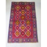 A hand knotted woollen new Baluchi rug, 128cm x 81cm