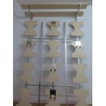 An Art Deco style wall mounted coat rack with adjustable hooks, 110cm x 74cm