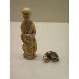 A 19th century Japanese carved ivory figure, 11cm tall, chips to foot and some age related cracks,