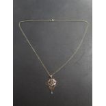 A 9ct yellow gold pendant on a 9ct 64cm long chain, approx 4.7 grams, in good condition