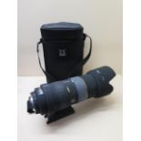 A Sigma EX 50-500mm 1:4 -6.3D APO HSM camera lens with tripod mount and case