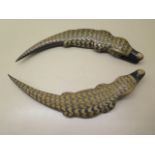 A pair of well carved horn crocodiles, 31cm long