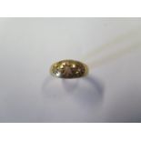 An 18ct yellow gold Victorian gypsy set diamond three stone ring with three 0.01ct old cut stones,