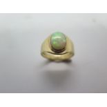A 9ct yellow gold oval opal ring, oval approx 10mm x 8mm, ring size R, in good condition and opal