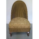 A Lloyd loom chair with drop in upholstered seat, 82cm tall, seat height 37cm