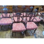 A set of 10 mahogany dining chairs with shield shaped backs overstuffed seats on square tapering