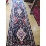 A rich blue ground large hand woven woollen full pile Persian Surouk runner in good condition, 461cm