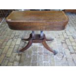 A Regency rosewood foldover card table in need of some restoration, 74cm tall x 92cm x 46cm