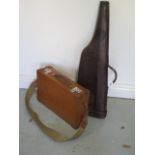 A vintage leather leg o mutton gun case, 79cm long, with a fitted leather case with shoulder strap