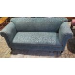 A well upholstered Victorian sofa on turned front legs, 81cm tall x 186cm x 78cm deep, in good