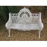 A good cast iron garden bench, 95cm tall x 119cm x 60cm, in painted condition