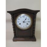 An 8 day oak case mantle clock strikes hours and half hours on gong, 28cm tall, in running order