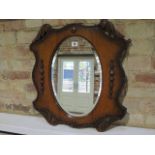 An oak wall mirror, 59cm x 53cm