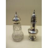 A silver caster, 17cm tall, small crack to top otherwise good and a silver top glass caster, total
