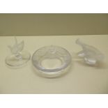 Three pieces of Lalique glassware, a dove trinket dish, a paperweight and a lion bowl, all good