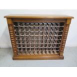 An oak 80 bottle wine rack, made by a local craftsman to a high standard, 99cm tall x 120cm x 30cm