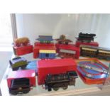 7 Hornby 0 gauge tinplate rolling stock, a level crossing and turntable and two tank locos (one