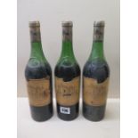 Three bottles of Chateau Haut-Brion 1970 Premier Grand Cru Classe red wine, levels low