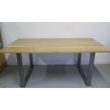 An oak and steel dining table made by a local craftsman to a high standard, 75cm tall x 183cm x 90cm