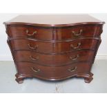 A good Georgian mahogany serpentine fronted oak lined four drawer commode chest, the top drawer