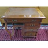 An Edwardian mahogany kneehole desk with four drawers and an inset top, 72cm tall x 78cm x 56cm,