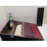 A Remy Martin Cognac V.S.O.P 50cl bottle in a presentation writing slope