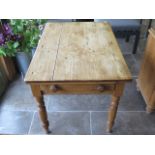 A small Victorian pine kitchen table with a single drawer on turned legs 72 cm tall 103 by 72 cm