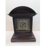 A Junghams oak mantle clock striking on two gongs with key, running, case good, 37cm tall