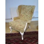A reupholstered Parker Knoll wing back armchair, 94cm tall x 70cm wide