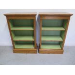 A pair of burr oak bookcases with adjustable shelves and painted interior, made by a local craftsman