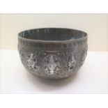 An Indian bronze type metal bowl possibly early 20th century decorated with 14 silver plated deities