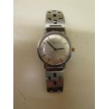 A Longines stainless steel manual wind wristwatch on a sports bracelet, 34mm case, in running order,