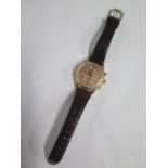 An 18ct Swiss chronograph gents manual wind wristwatch on leather strap, 36mm case, in working