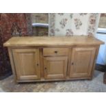 A John Lewis solid oak bergerac sideboard with three doors and a single drawer, 90cm tall x 172cm