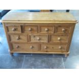 A Victorian style 9 drawer Merchants chest 79 cm tall , 122 by 46 cm , some wear mainly to top but a