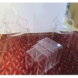 A pair of Kartell Louis Ghost chairs by Philippe Stark, a perspex side table, 70cm tall x 83cm x
