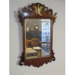 A 19th century bevelled glass mirror with mahogany surround, 69cm x 41cm