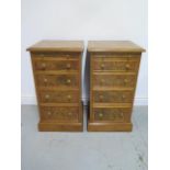 A pair of burr oak four drawer bedside chest each with a slide, made by a local craftsman to a