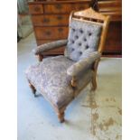 A Victorian Oak button back fireside chair , recently reupholstered 91 cm tall
