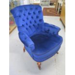A reupholstered Victorian button back armchair, 95cm tall x 82cm wide, in good condition