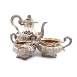 λA three-piece George IV silver coffee set, by Emes and Barnard, London 1828, lobed baluster form,