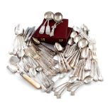 A mixed lot of silver flatware, various dates and makers, comprising: a mother-of-pearl handled