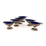 A set of six George III Irish silver salt cellars, Dublin, the majority of marks lost in piercing,