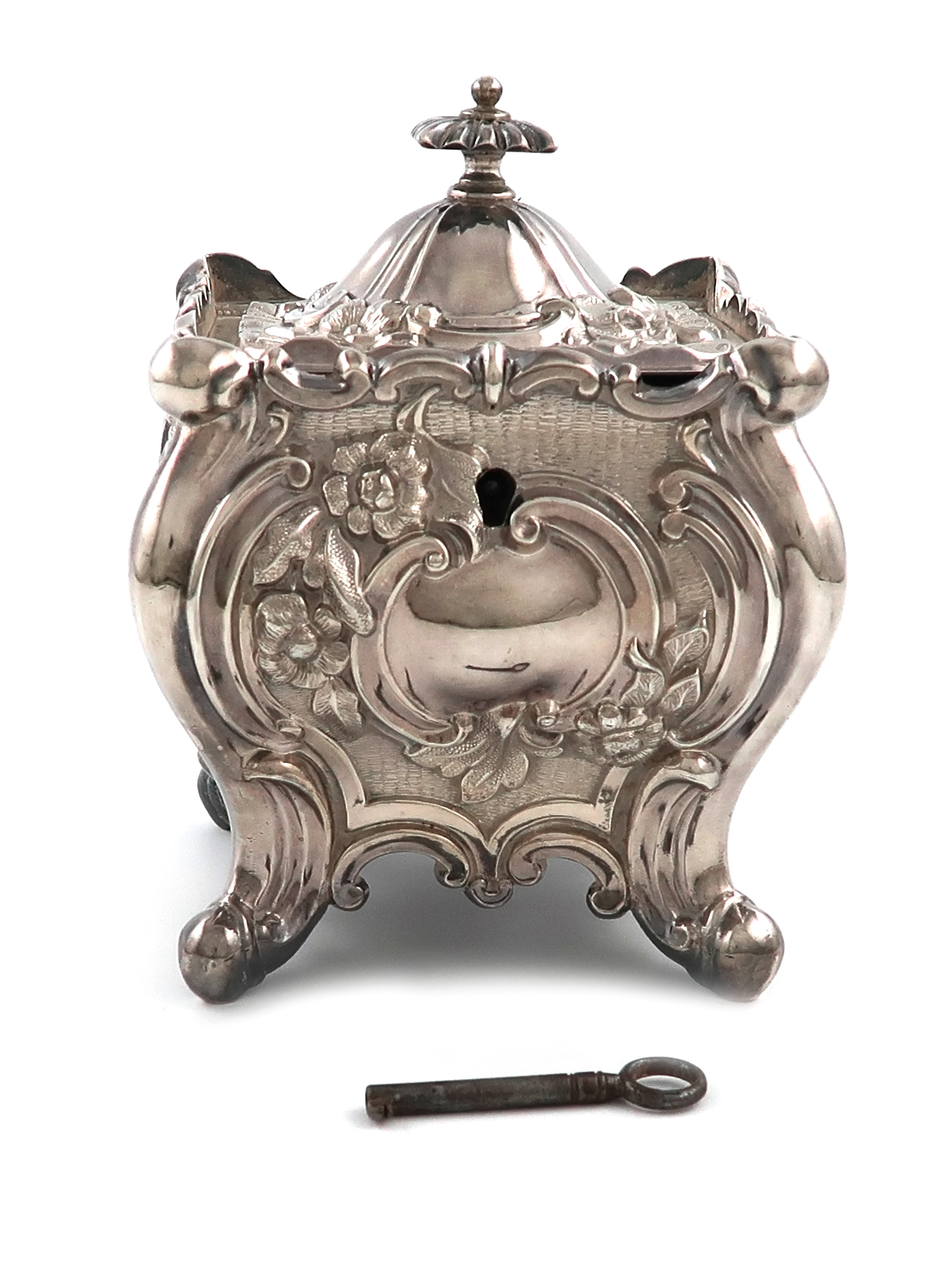A late-Victorian silver tea caddy, by Jenkins & Timm, Sheffield 1894, square bombé form, embossed