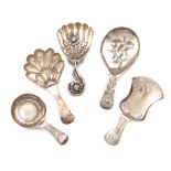 A collection of five antique silver caddy spoons, various dates and makers, including: a Victorian