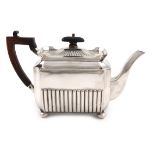 A late-Victorian silver teapot, by Gibson and Langman, London 1897, rectangular form, scroll handle,