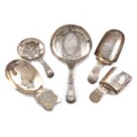 A collection of five antique silver caddy spoons, various dates and makers, including: a George