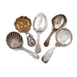 A collection of five antique silver caddy spoons, various dates and makers, including: a Victorian